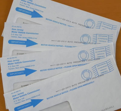 New Jersey motor vehicle registration envelopes.  All sent at the same time to the same address.