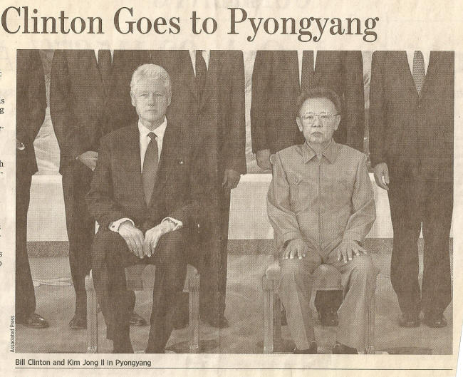 Clinton and Kim Jong Il posing for a picture in Pyongyang August 4, 2009