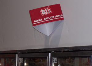 Meal Solutions sign over cabinet